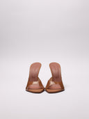 . Vista frontale delle Alexa Glass Slipper in PVC nude.
