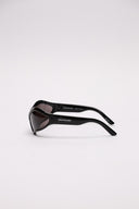 Occhiali da sole Balenciaga in acetato nero, vista laterale con dettagli di finitura.