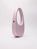Borsa Coperni Swipe Bag in pelle rosa, vista diagonale