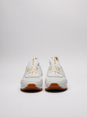 Vista frontale sneaker EA7 bianche e oro