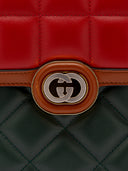 Dettaglio chiusura borsa Gucci in pelle tricolore 