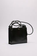 Borsa Jil Sander in pelle nera lucida con manici intrecciati.