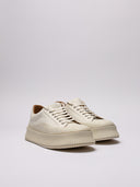 sneakers Jil Sander in canvas bianco con suola platform.