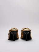Vista posteriore mule JW Anderson dorati