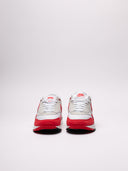 Sneakers Nike Air in bianco e rosso con dettagli iconici.