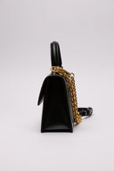 Borsa elegante in pelle nera Off-White con dettagli metallici dorati.