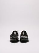 Immagine di un mocassino Saint Laurent in vernice nera, vista frontale 