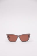 Occhiali da sole Saint Laurent in acetato con lenti color caramello, vista frontale e laterale.