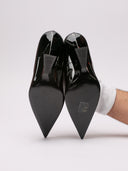 Immagine di stivali neri in pelle con tacco trapezio di THE ATTICO, visione completa del design.