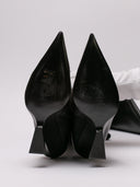 Immagine di stivali neri in pelle con tacco trapezio di THE ATTICO, visione completa del design.